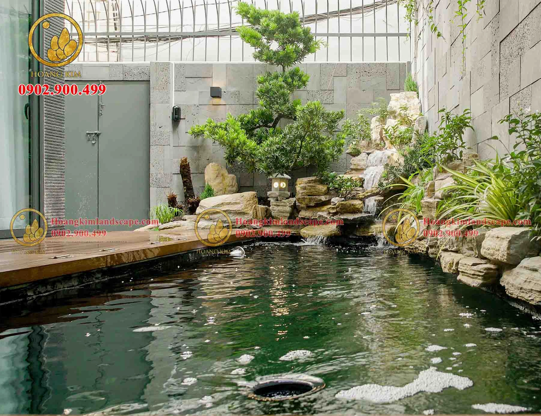 Hòn non bộ thác nước kết hợp hồ cá Koi với làn nước trong và đá xếp tự nhiên