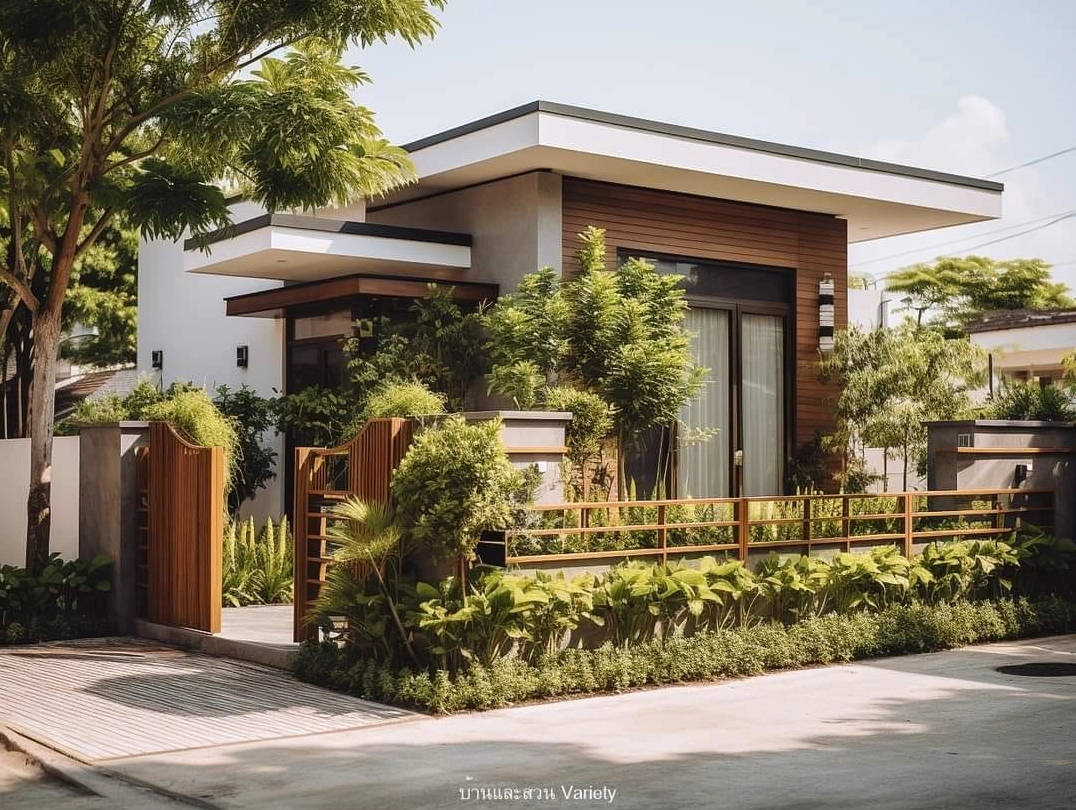 Sân vườn trước nhà được trang trí bằng cây xanh và chi tiết cảnh quan duyên dáng