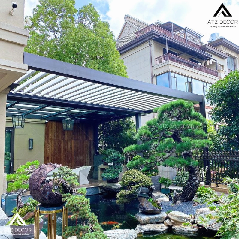 Tiểu cảnh sân vườn sau nhà phủ cây xanh tạo nơi nghỉ ngơi kín đáo và mát lành